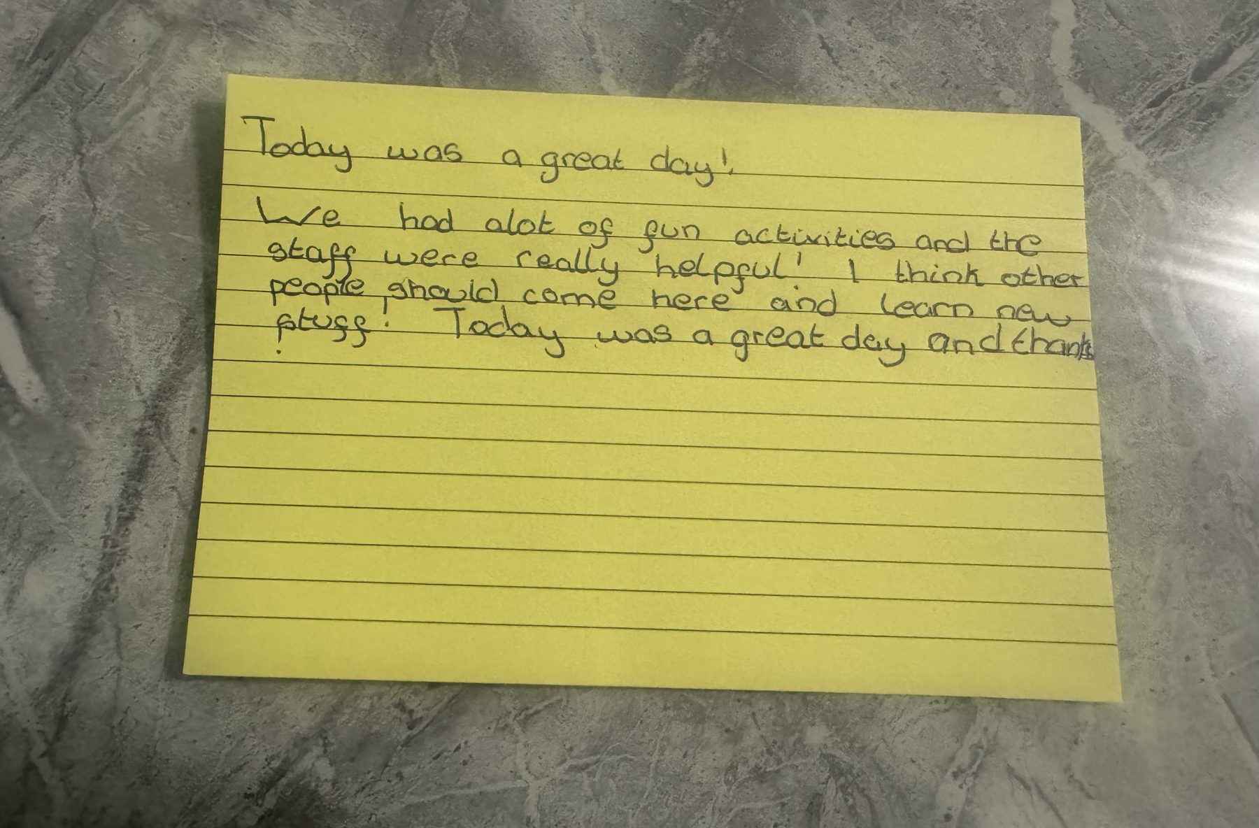 Handwritten feedback card: Today was a great day! We had a lot of fun activities and the staff were really helpful. I think other people should come here and learn new stuff.